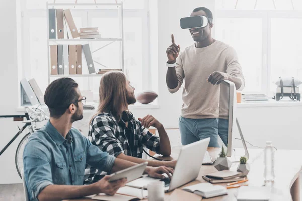 Young man adjusting VR headset