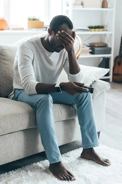 Man holding remote control — Stock Photo, Image