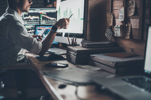 Businessman pointing on chart 