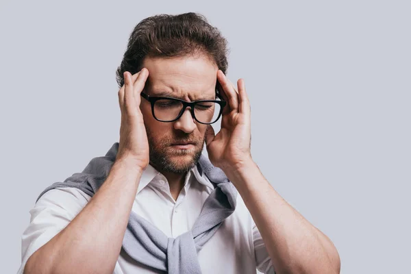 Man touching his head with hands — Stock Photo, Image