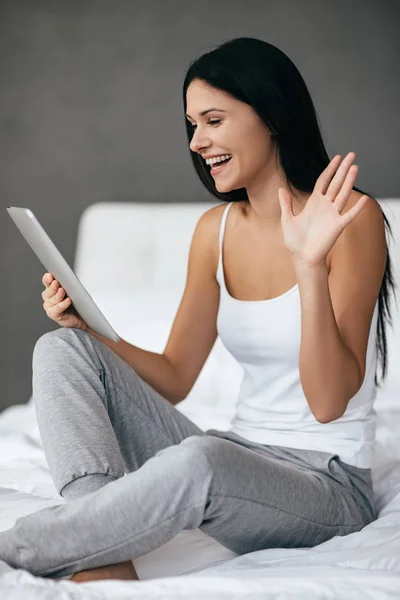 Gorgeous woman looking at digital tablet