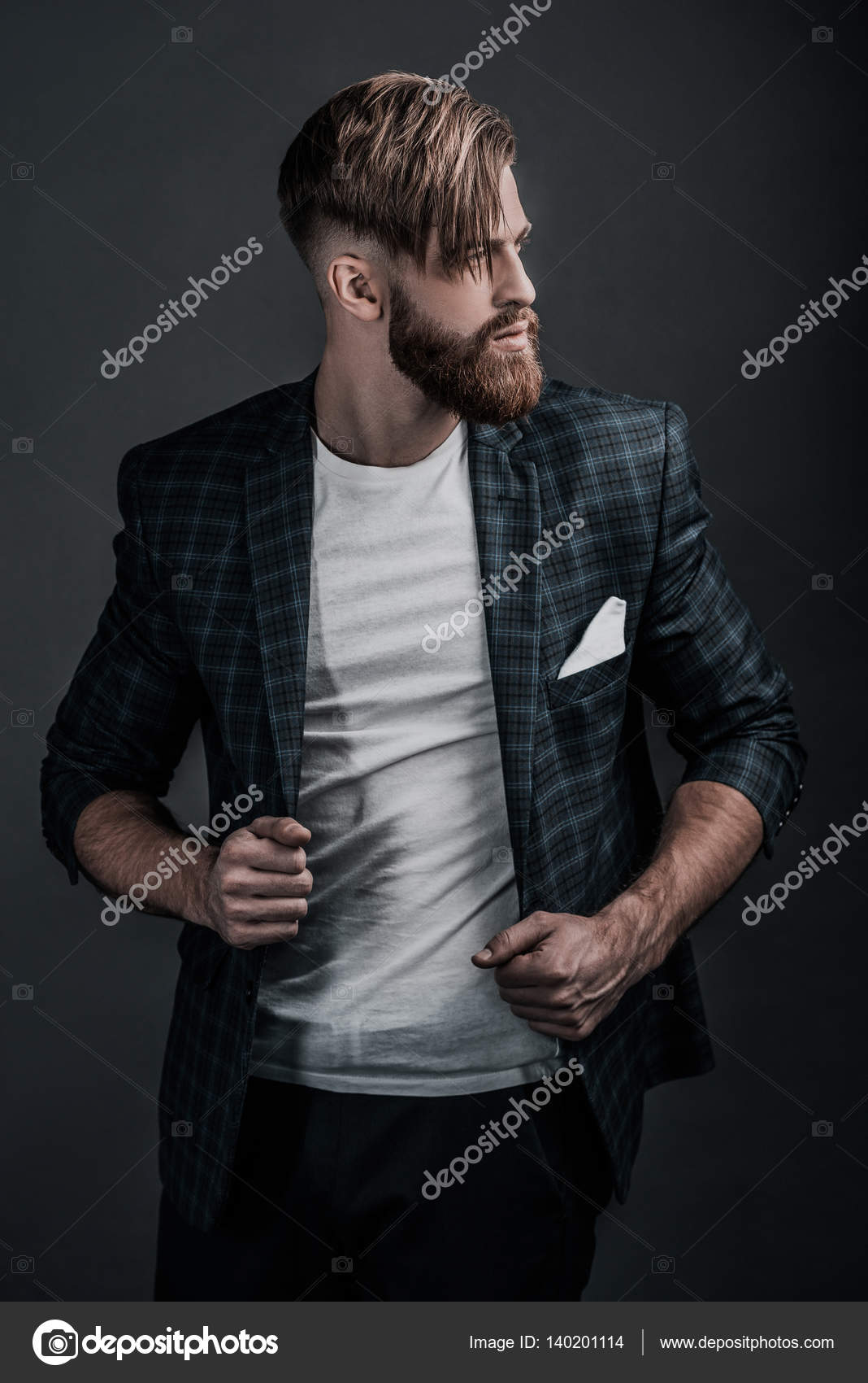 Stylish man adjusting jacket Stock Photo by ©gstockstudio 140201114