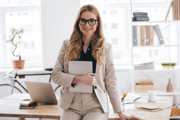 businesswoman holding digital tablet