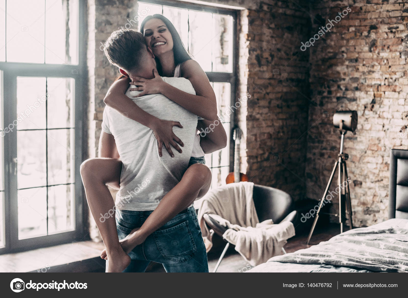 Beautiful Couple Having Fun In Bedroom Stock Photo