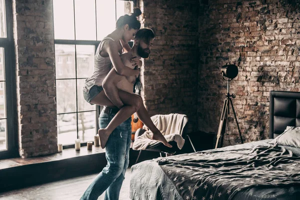 Beautiful couple in bedroom — Stock Photo, Image