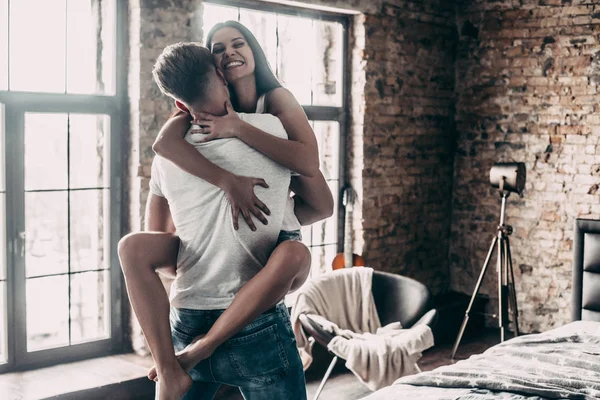 Beautiful couple having fun in bedroom — Stock Photo, Image