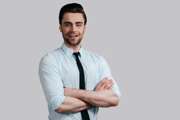 Attractive man holding crossed arms — Stock Photo, Image