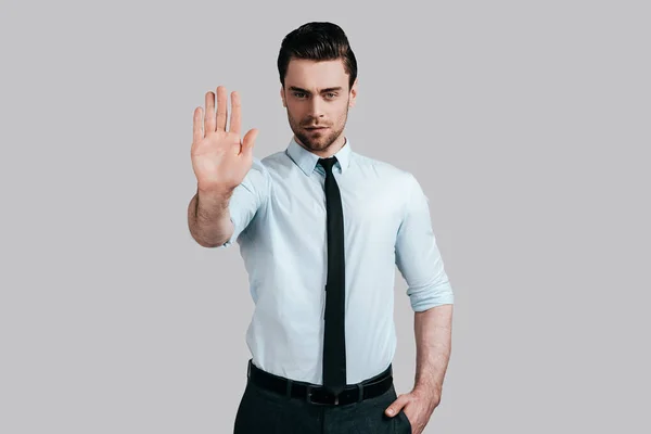 Serious man showing stop palm — Stock Photo, Image