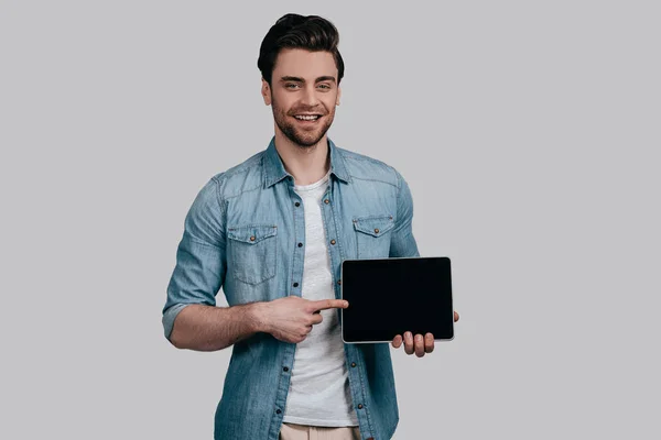 Man pointing finger on digital tablet — Stock Photo, Image