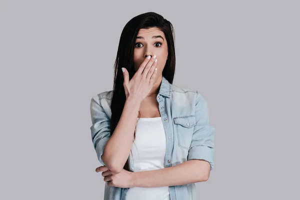 Shocked woman covering mouth by hand — Stock Photo, Image