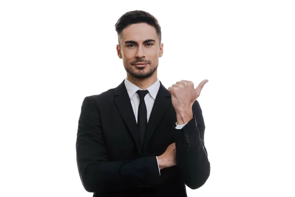 Hombre de negocios en traje negro señalando con el dedo —  Fotos de Stock