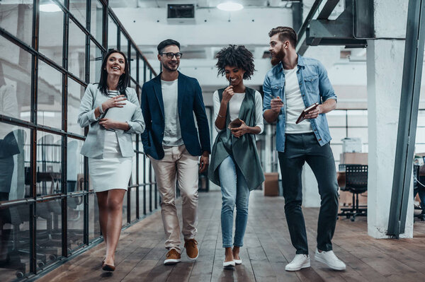 business people walking in modern office