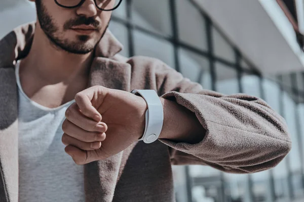 Stylish man looking at his watch — Stock Photo, Image