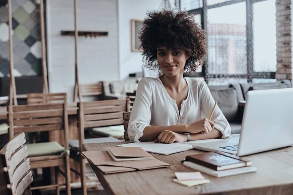 Beautiful woman holding pencil — Stock Photo, Image