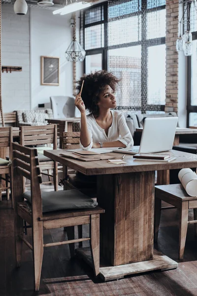 Beautiful woman holding pencil — Stock Photo, Image