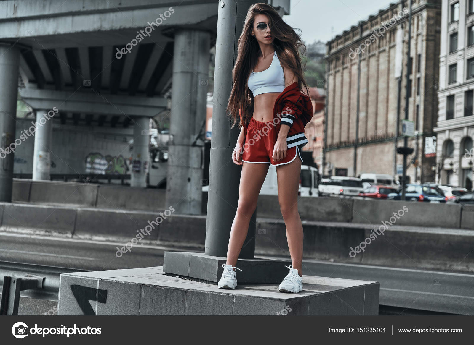 Woman in sport clothing posing in street Stock Photo by ©gstockstudio  151235104