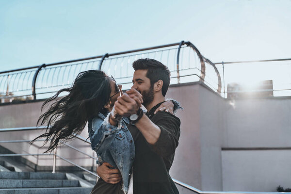 dance of happy beautiful couple