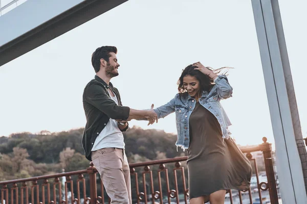 Couple having fun and holding hands — Stock Photo, Image