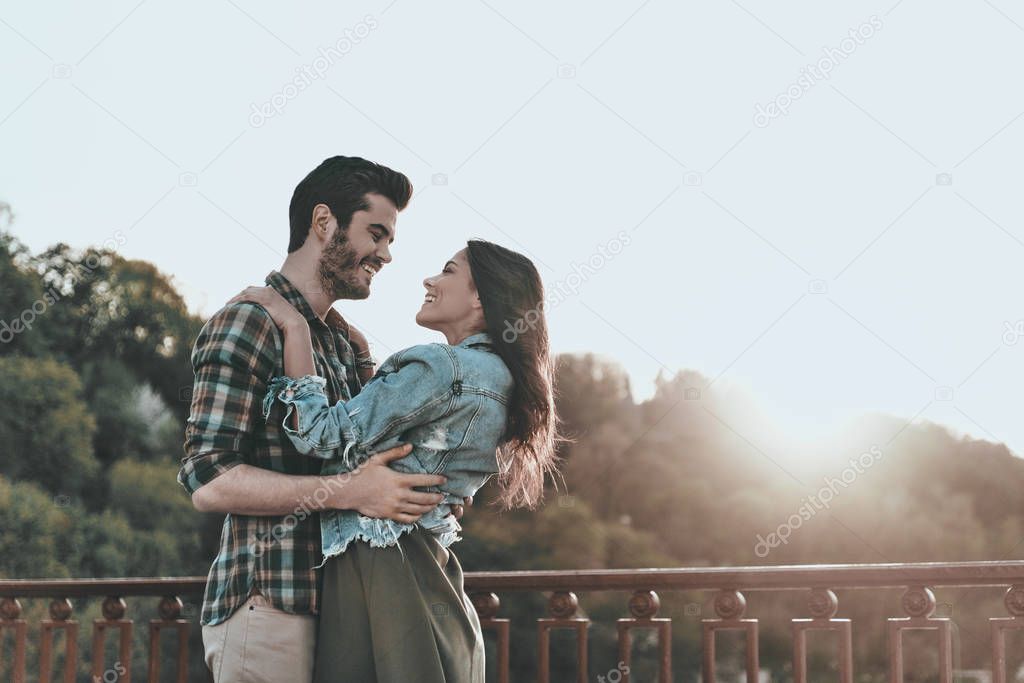 Romantic couple hugging and smiling