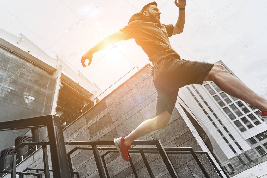 active man jumping on stairs