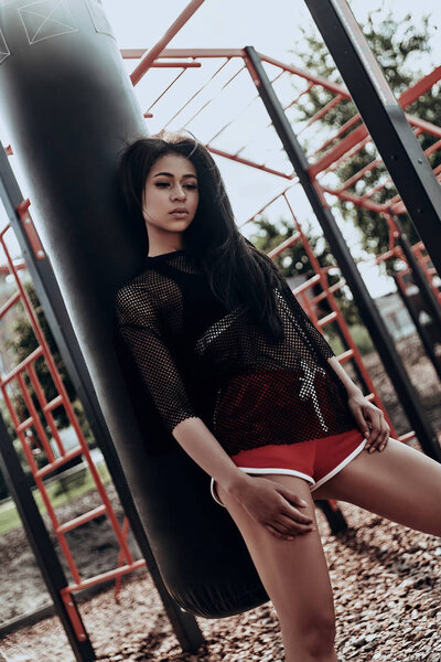 brunette woman in red shorts