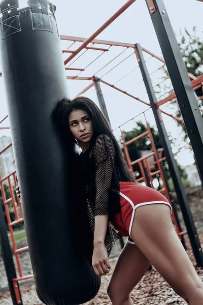 Brunette woman in red shorts — Stock Photo, Image