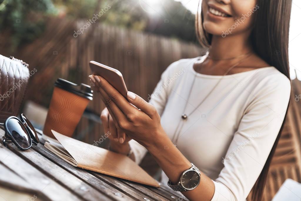 woman holding smart phone 