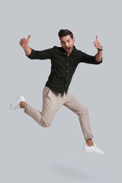 Handsome young man jumping — Stock Photo, Image