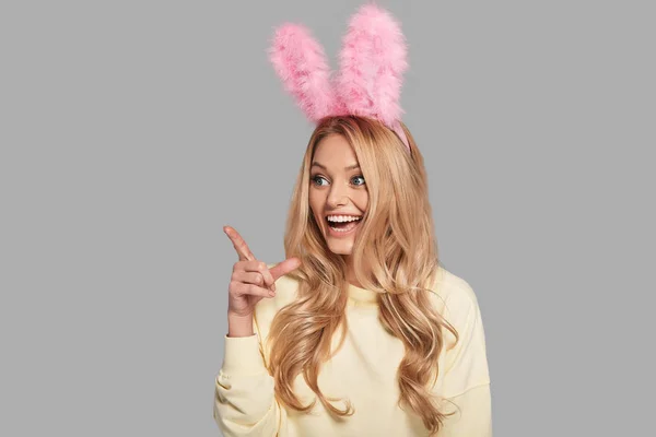 Woman in pink bunny ears — Stock Photo, Image
