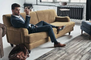 businessman relaxing on sofa 