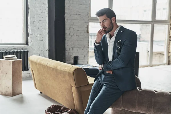 Thoughtful handsome young businessman in suit — Stock Photo, Image