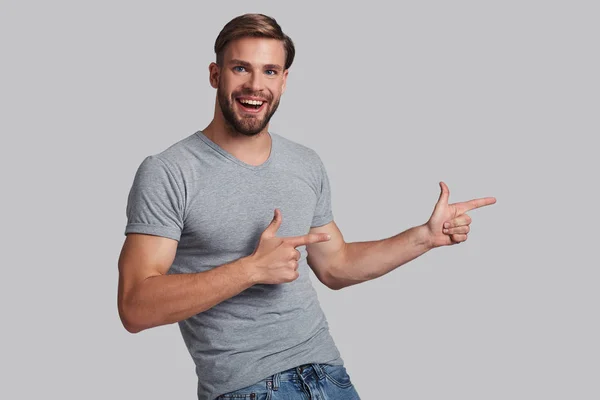 Man pointing fingers on side — Stock Photo, Image