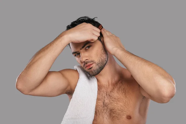 Brunette Man Combing Hair Grey Background Studio White Towel Shoulder — Stock Photo, Image