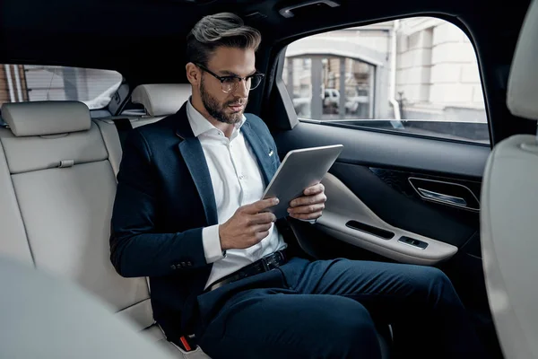 Confident Young Man Suit Using Digital Tablet While Sitting Car — Stock Photo, Image