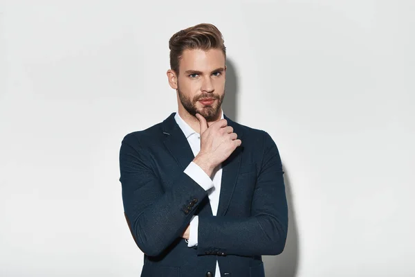 Handsome Young Man Suit Jacket Keeping Hand Chin Looking Camera — Stock Photo, Image