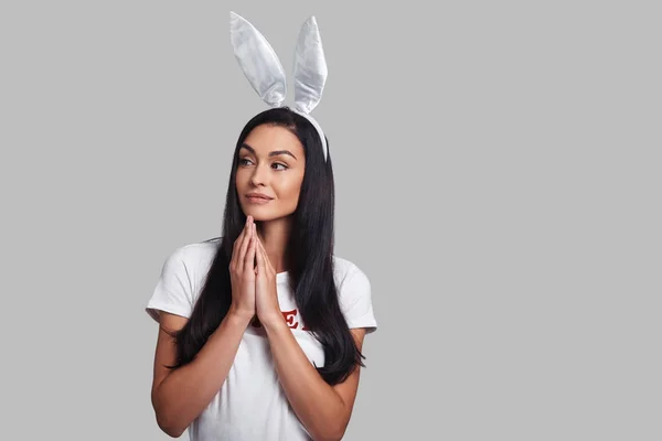 Brunette Young Woman Bunny Ears Posing Studio Hands Clasped — Stock Photo, Image