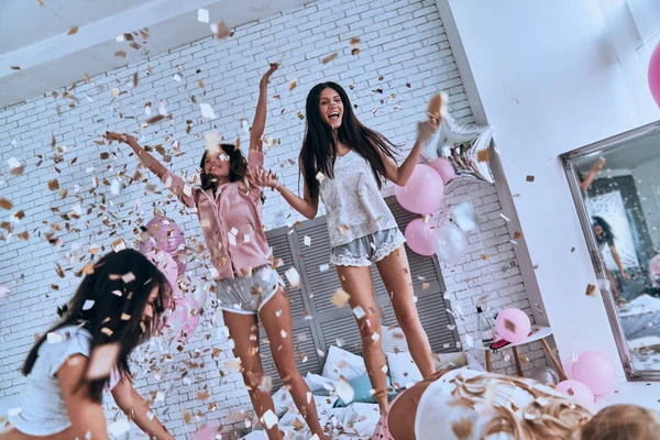 Happy Young Women Pajamas Jumping Bedroom Confetti Balloons — Stock Photo, Image