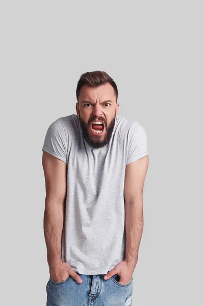 Angry Young Man Looking Camera Shouting While Standing Grey Background — Stock Photo, Image