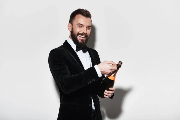 Man Suit Opening Bottle Champagne Smiling Studio — Stock Photo, Image