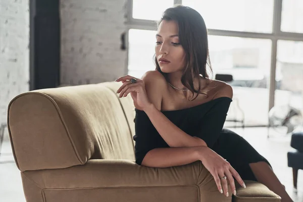 Portrait Gorgeous Woman Elegant Black Dress Sitting Sofa Looking Ring — Stock Photo, Image