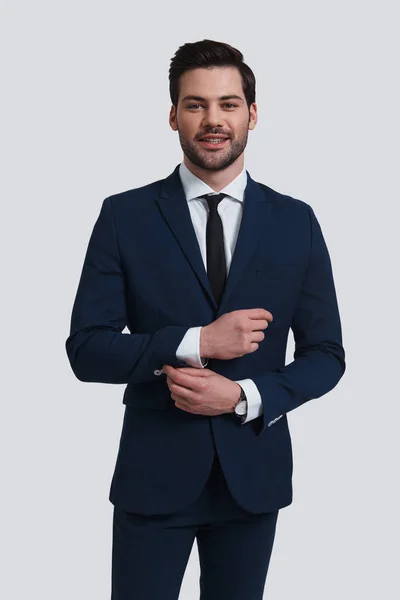 Young Man Suit Adjusting Sleeve Looking Camera Smile While Standing — Stock Photo, Image