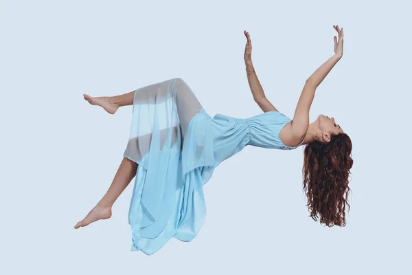 Attractive Young Woman Blue Dress Keeping Arms Outstretched While Hovering — Stock Photo, Image