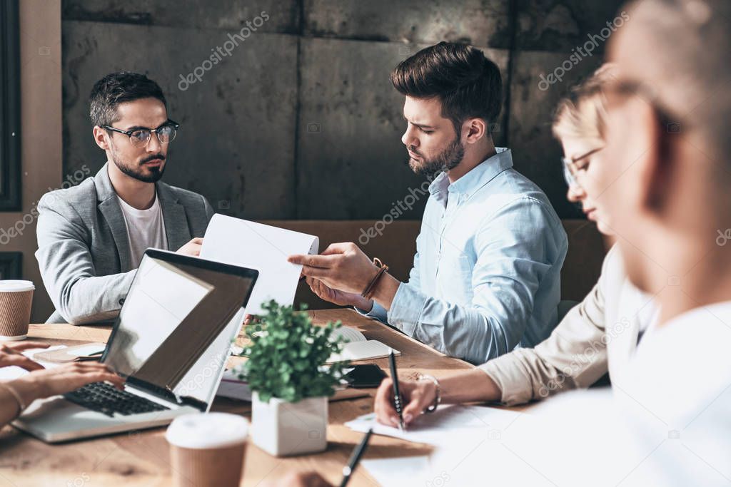 young business people discussing ideas at office table 