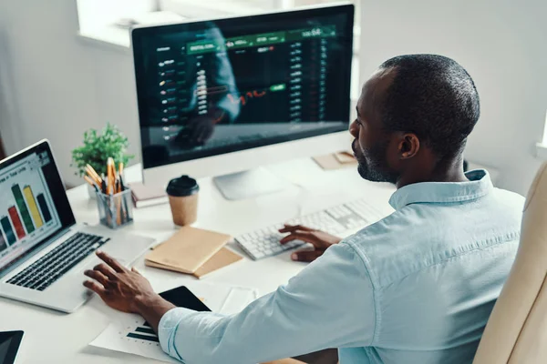 Rear Top View Young African Man Shirt Using Computer While — Stock Photo, Image