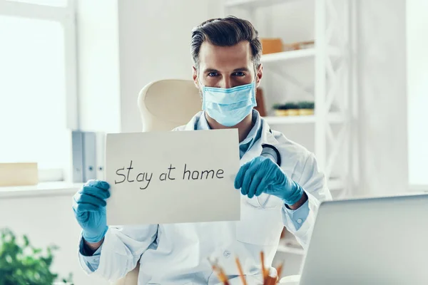 Young Man White Lab Coat Protective Mask Showing Stay Home — Stock Photo, Image