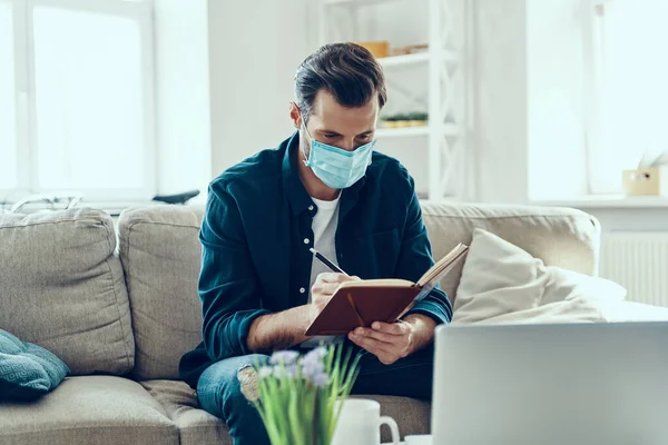 Busy Young Man Protective Face Mask Writing Something While Working — Stock Photo, Image