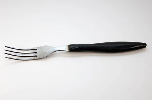 Çatal beyaz arka planda siyah saplı çatal