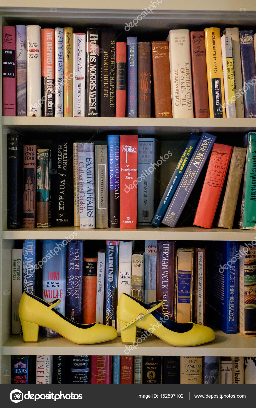 Yellow Wedding Shoes On Bookshelf Stock Editorial Photo