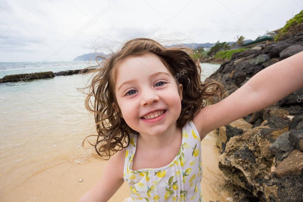 Child Playing on Beach in Oahu Hawaii