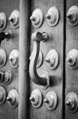 old doors close up view - knobs, design elements, architecture of the ancient doors within the streets of the spanish cities